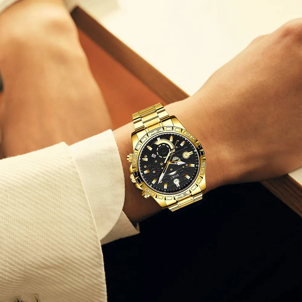 Gold-coloured men's business watch with a stainless steel band and a single folding buckle on a wrist