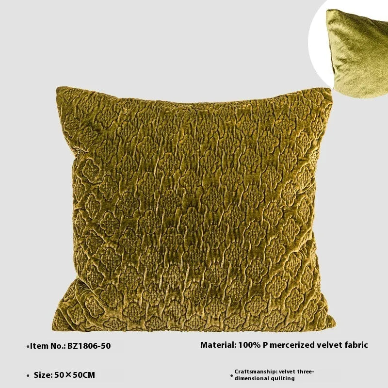 Brown gold antique style quilted square cushion with three-dimensional texture on a sofa.