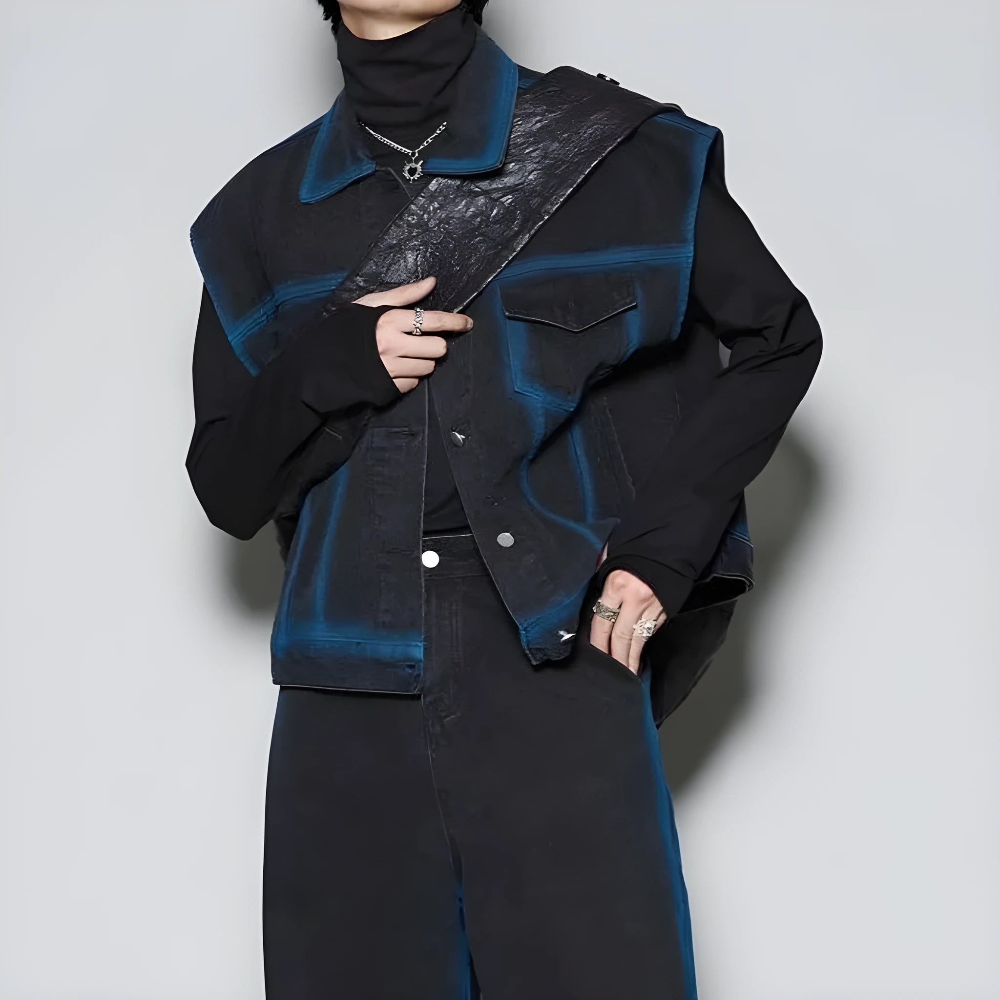 Blue distressed fleece-lined vest and jeans suit on a model, showing the spray colour gradient finish.