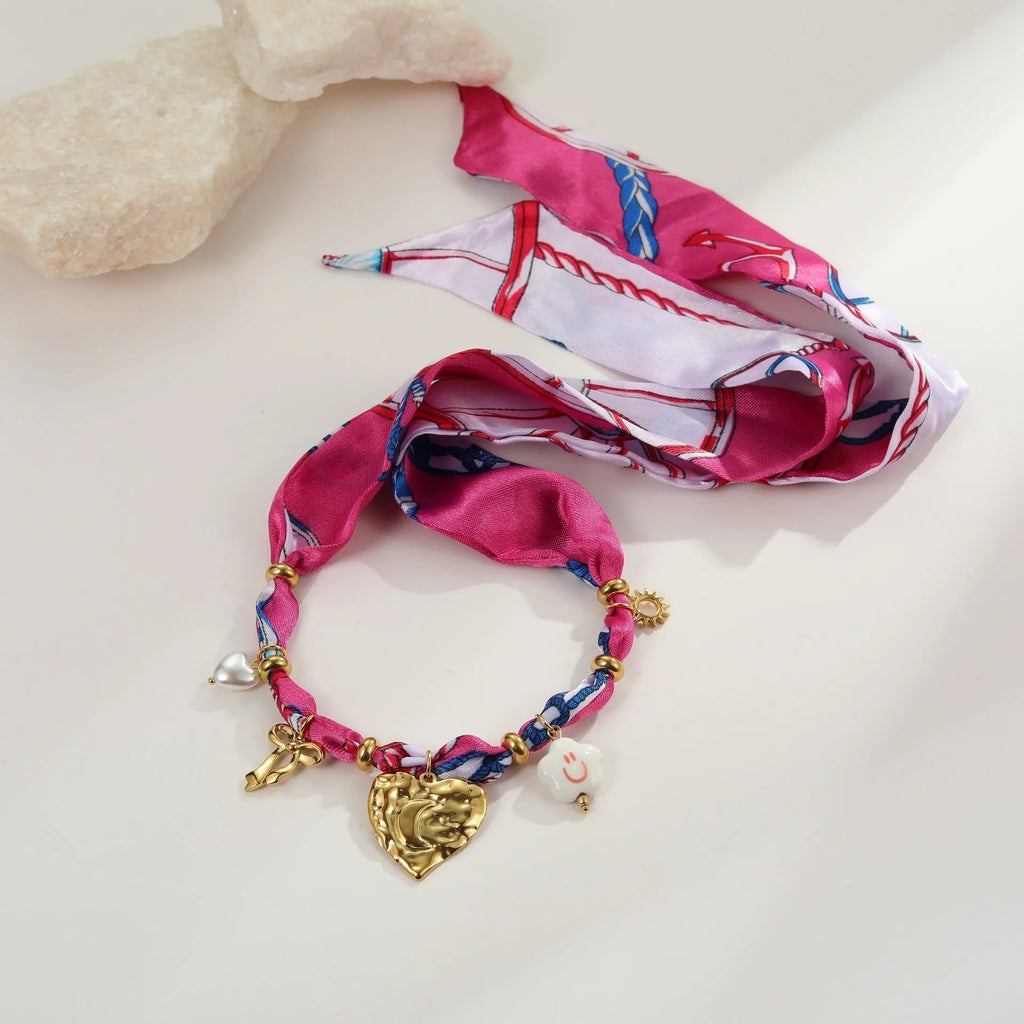 Stainless steel necklace and bracelet set with geometric pendant featuring a colourful silk scarf insert