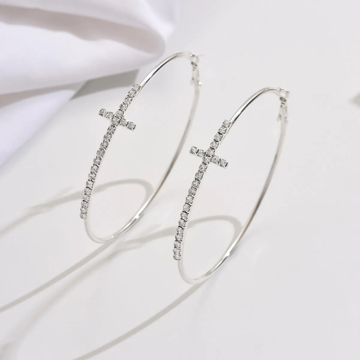 Geometric round rhinestone cross earrings for women in gold copper finish