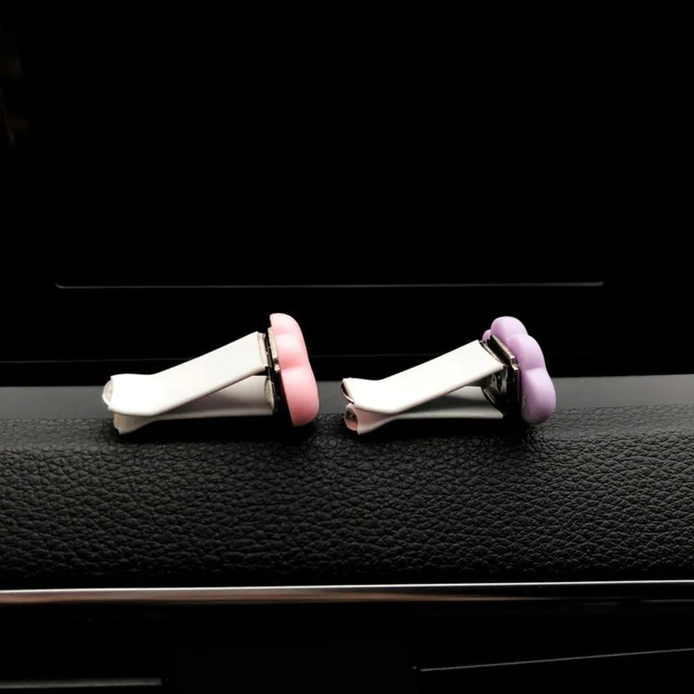 Cartoon Baiyun design resin car fragrance clip for air vents in assorted colours.