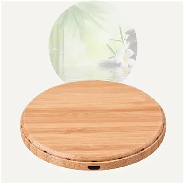 Natural bamboo wireless charger pad on desk with a smartphone placed on it