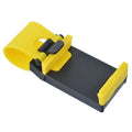 Black universal steering wheel phone holder clip mounted on a car steering wheel, holding a smartphone.