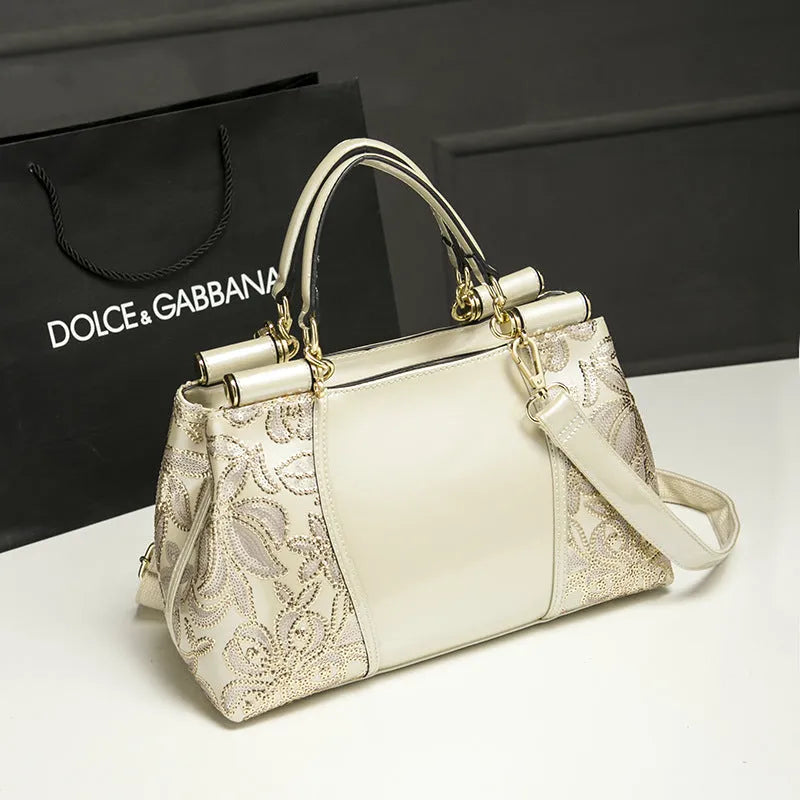 Patent leather handbag with sequin bead embroidery in blue, adjustable shoulder strap, crossbody style