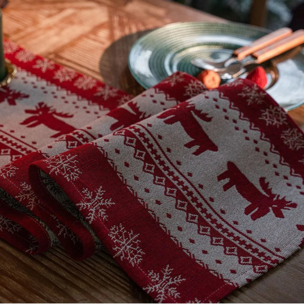 Home Christmas jacquard table runner in polyester cotton with jacquard red deer flat hem design on a table setting
