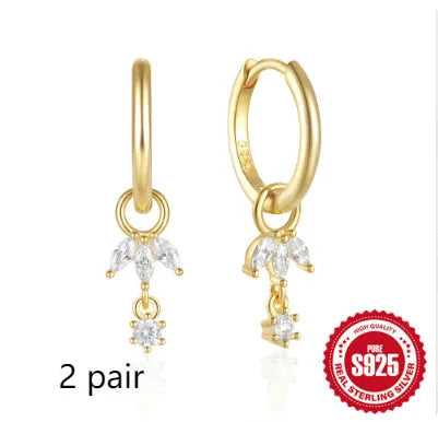 A pair of S925 sterling silver geometric earrings featuring a sunflower design with inlaid golden zircon stones.