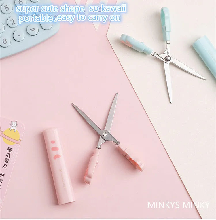 Creative cat claw folding scissors in pen type design, blue colour, on a white background