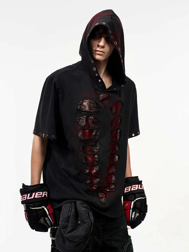 Black loose-fit men's hooded sequin T-shirt on a hanger