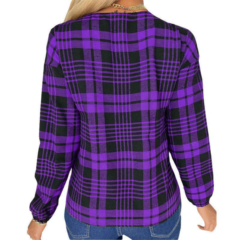 Women's grey plaid loose long sleeve casual shirt on a hanger.