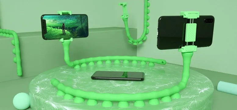 Flexible rubber phone holder with suction cup mount showing 360 degree rotation capability