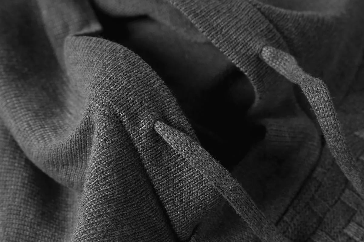 Men's black cotton-polyester hooded sweatshirt on a hanger, showing the front and hood.