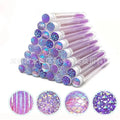 Disposable eyelash mascara brushes in transparent storage tubes showing blue, green, pink and purple colour options