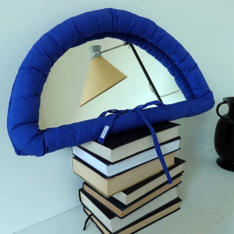 Hanging wall mirror with soft cotton-filled fabric border in black, sapphire blue, or white