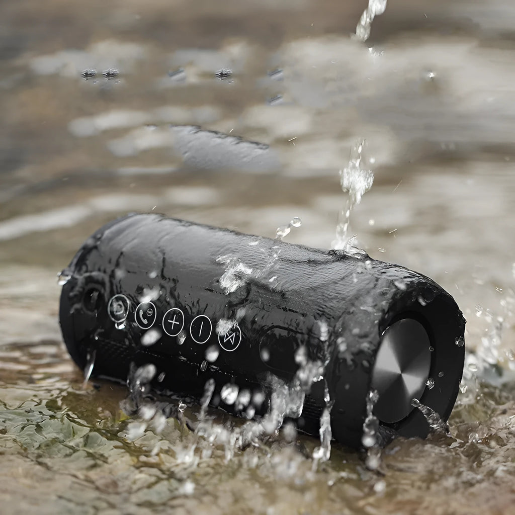 Compact outdoor waterproof speaker in choice of black, camouflage, grey, or red, showing control buttons and ports.