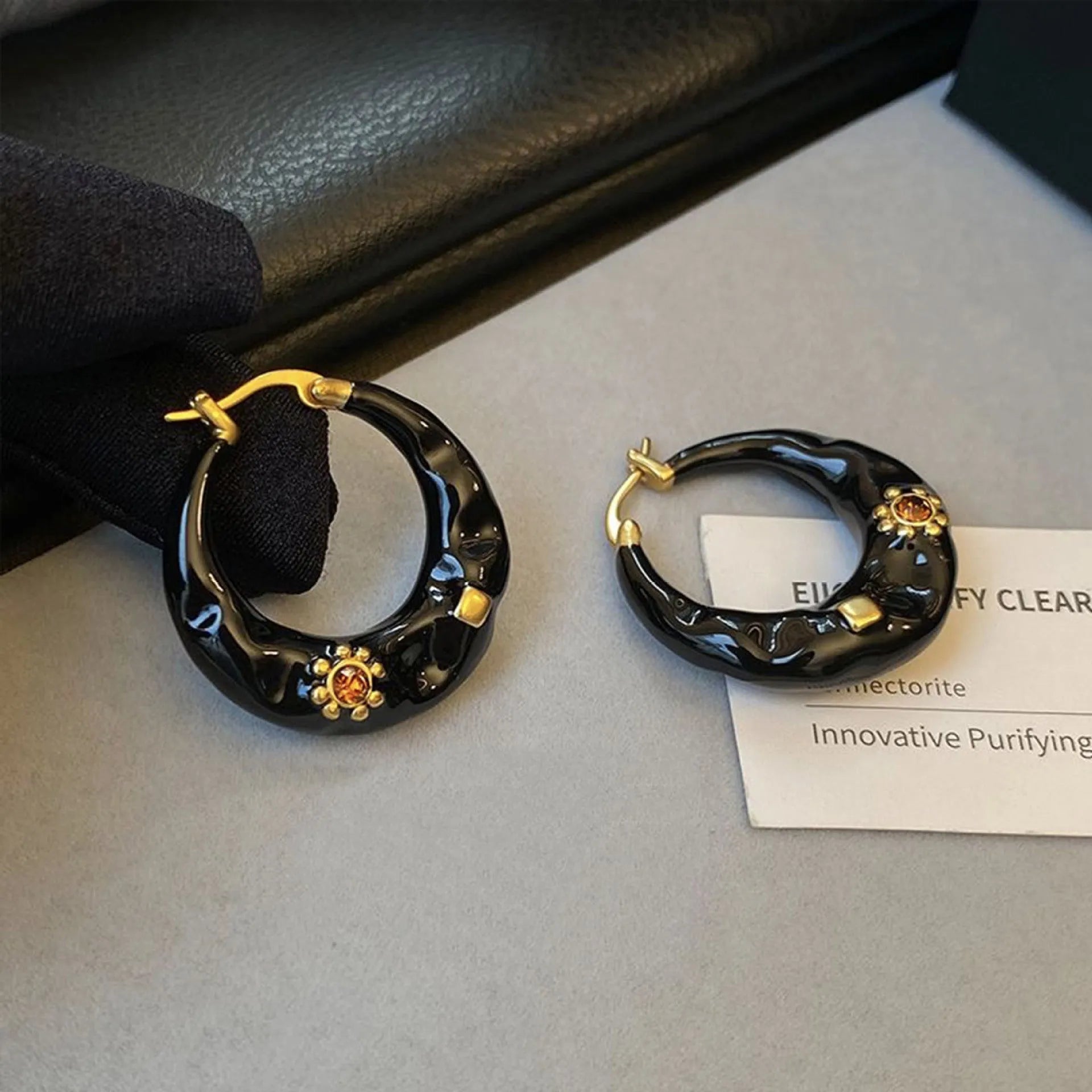 Hong Kong style retro ear studs with rhinestone inlay and dripping oil finish in black and red colours