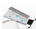 Mini folding Bluetooth keyboard with aluminium alloy backboard, hidden stands, and three-device memory, shown open.