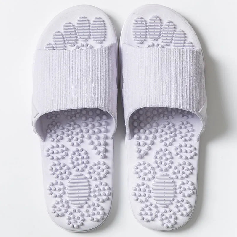 Reflexology acupressure slippers in EVA material with 3D massage particles, available in blue, grey, light blue, pink, purple