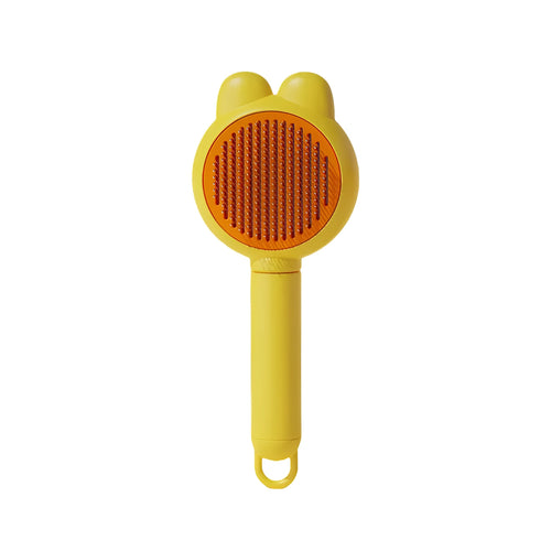 Green pet grooming brush with a self-cleaning button and a stainless steel comb.