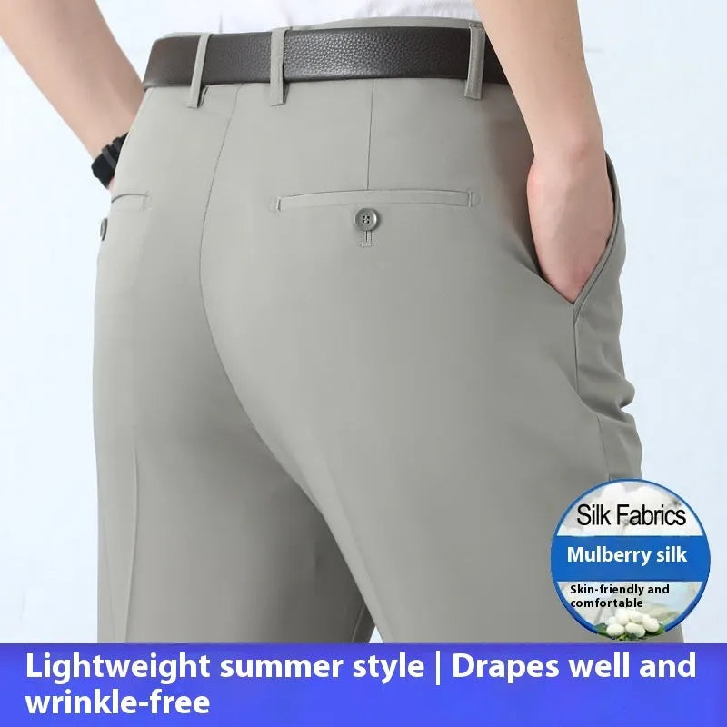 Men's dark blue straight-leg suit trousers with a high waist and non-iron finish on a hanger.