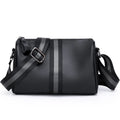Black genuine leather one-shoulder crossbody bag showing its large capacity and strap.