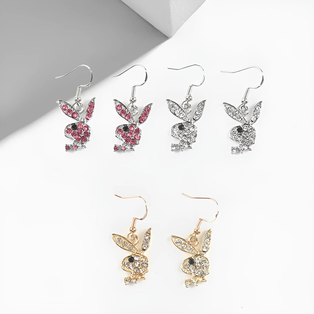Pair of rabbit-shaped stud earrings with diamond accents on a silver background, showing front and back with butterfly clutch.