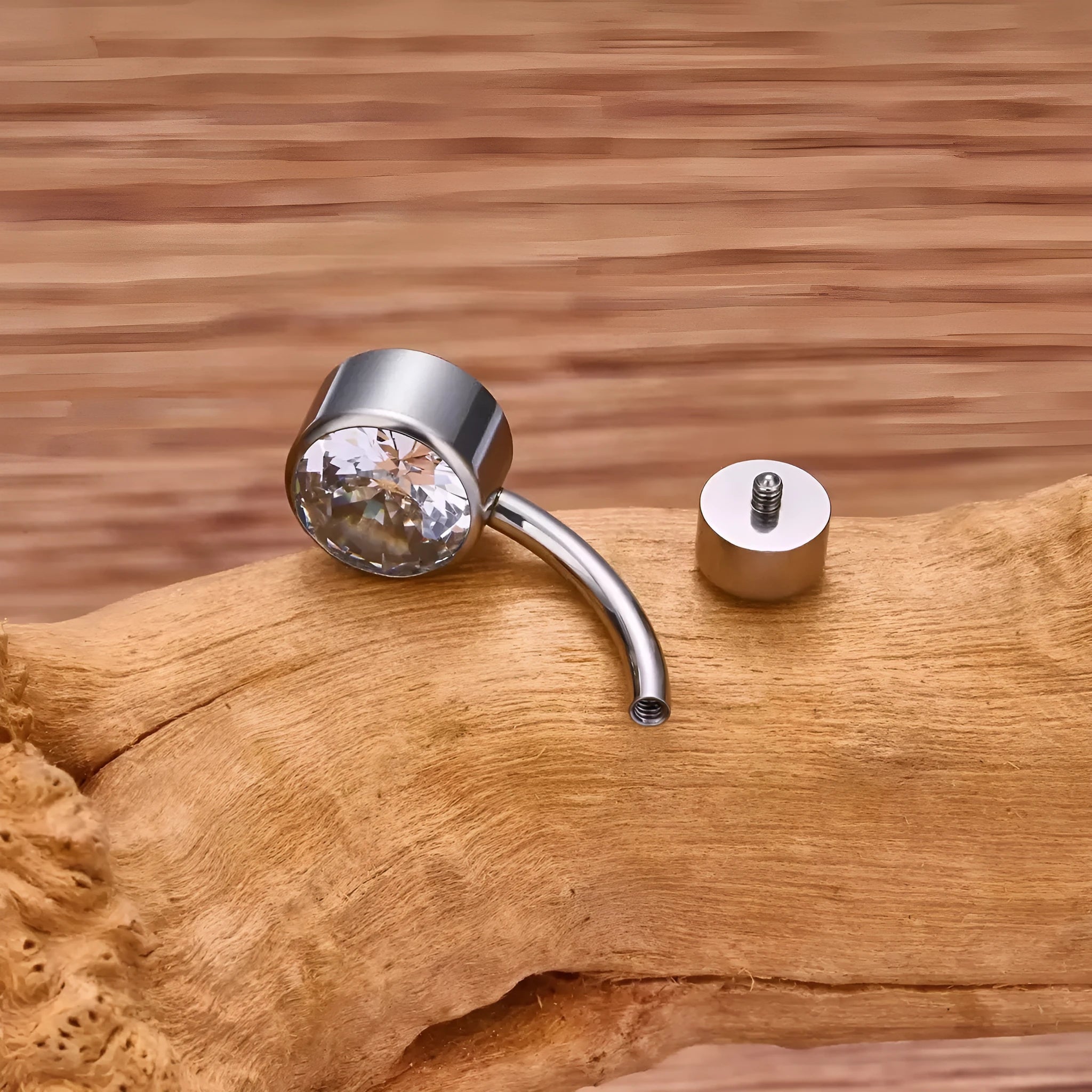 Titanium alloy double-headed navel stud with internal thread in various colours and sizes.