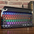 Black retro typewriter mechanical keyboard with backlit keys on a desk