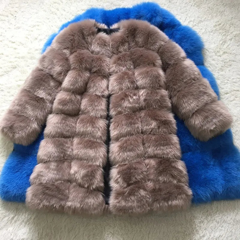Women's thick black artificial fur coat with regular sleeves on a model.