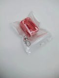 Black plastic seat belt buckle clamp holder for child car seat safety.