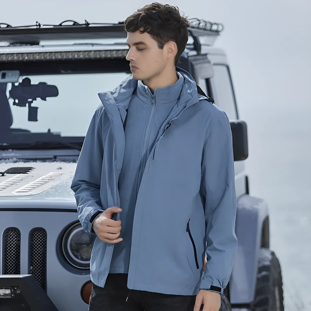 Men's removable two-piece waterproof mountaineering suit in various colours on a hanger.