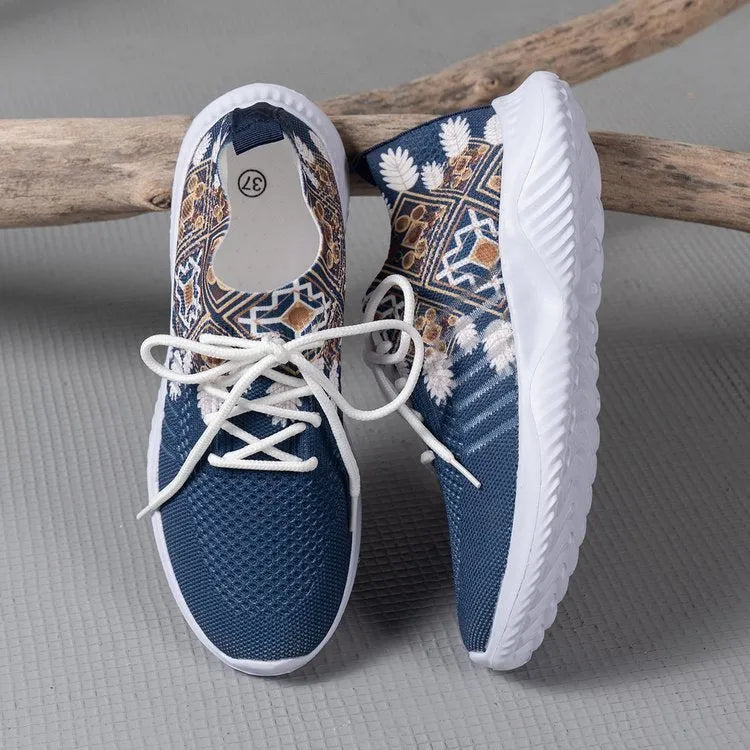 Women's woven flat casual sneakers in green with mesh upper, round toe, front lace-up, and rubber sole