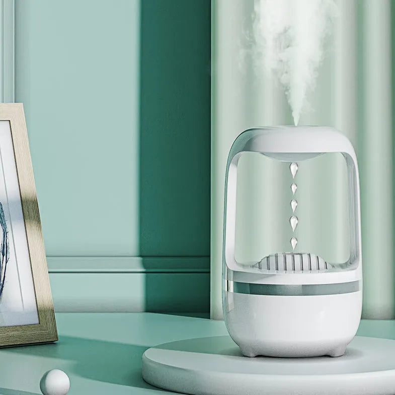 Black and white anti-gravity humidifier showing water droplet effect with USB cable