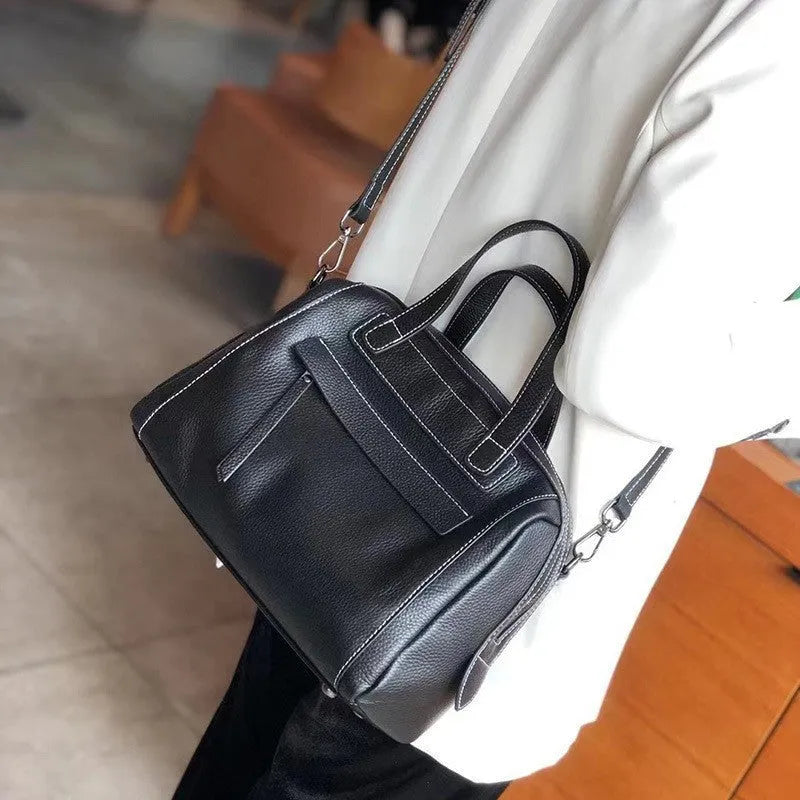 Genuine cowhide leather messenger bag with lychee pattern texture in horizontal square shape showing internal compartments