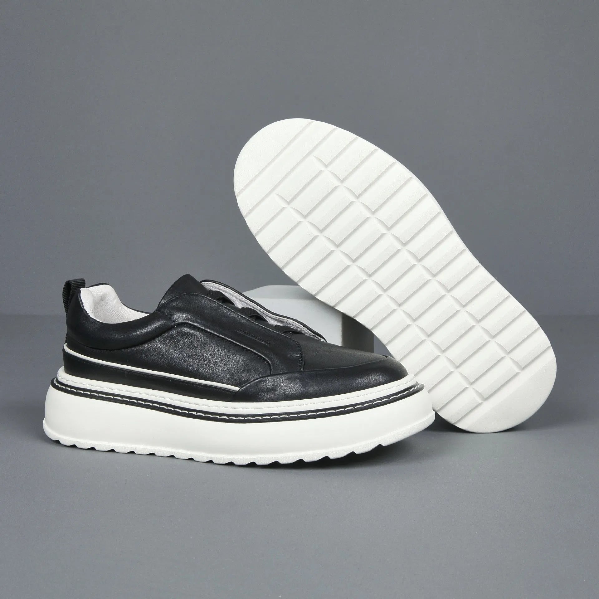 Breathable casual slip-on sneaker with first layer cowhide upper and foam sole, black, side view