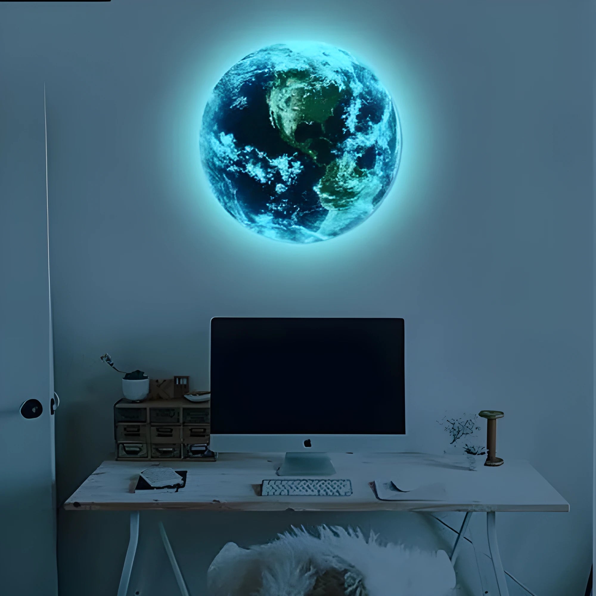 Glow in the dark 3D Earth planet wall sticker in three size options on a dark blue background.