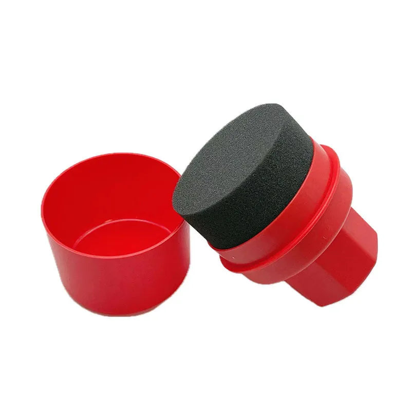 Black and red car tyre polishing sponge brushes with lids on a tyre, showing flat and curved sponge edges.