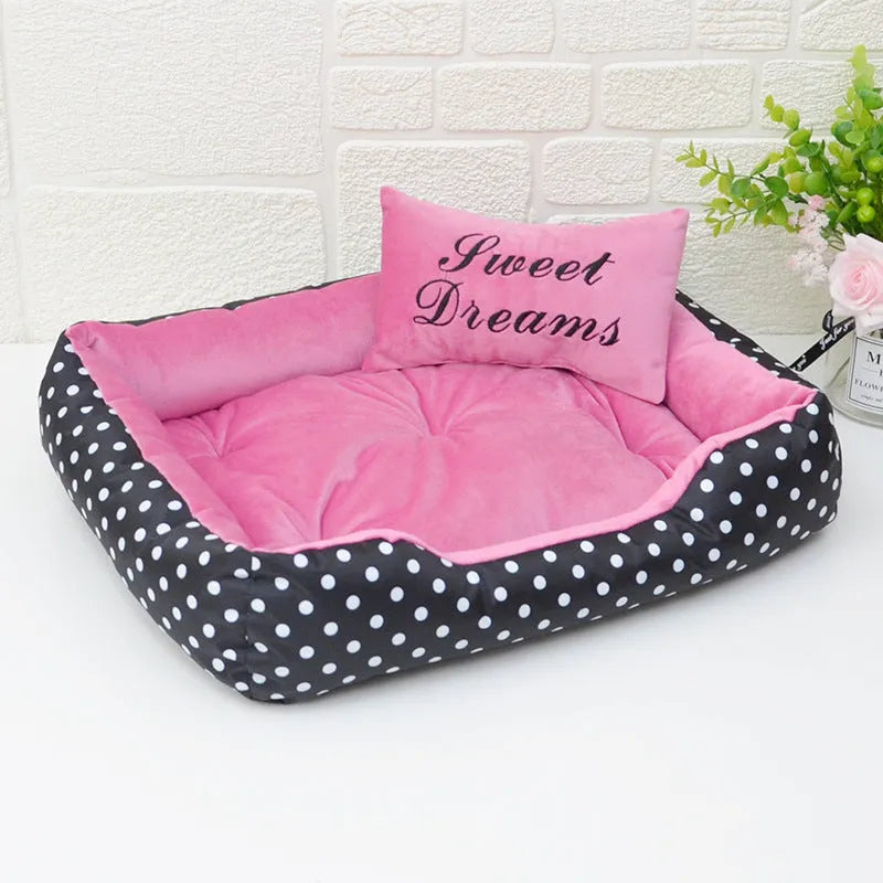 Small polka dot print square dog bed with a matching square pillow inside, shown in grey colour.