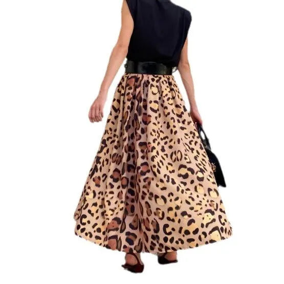 Brown leopard print women's long A-line skirt with a wide, flowing hem on a hanger.