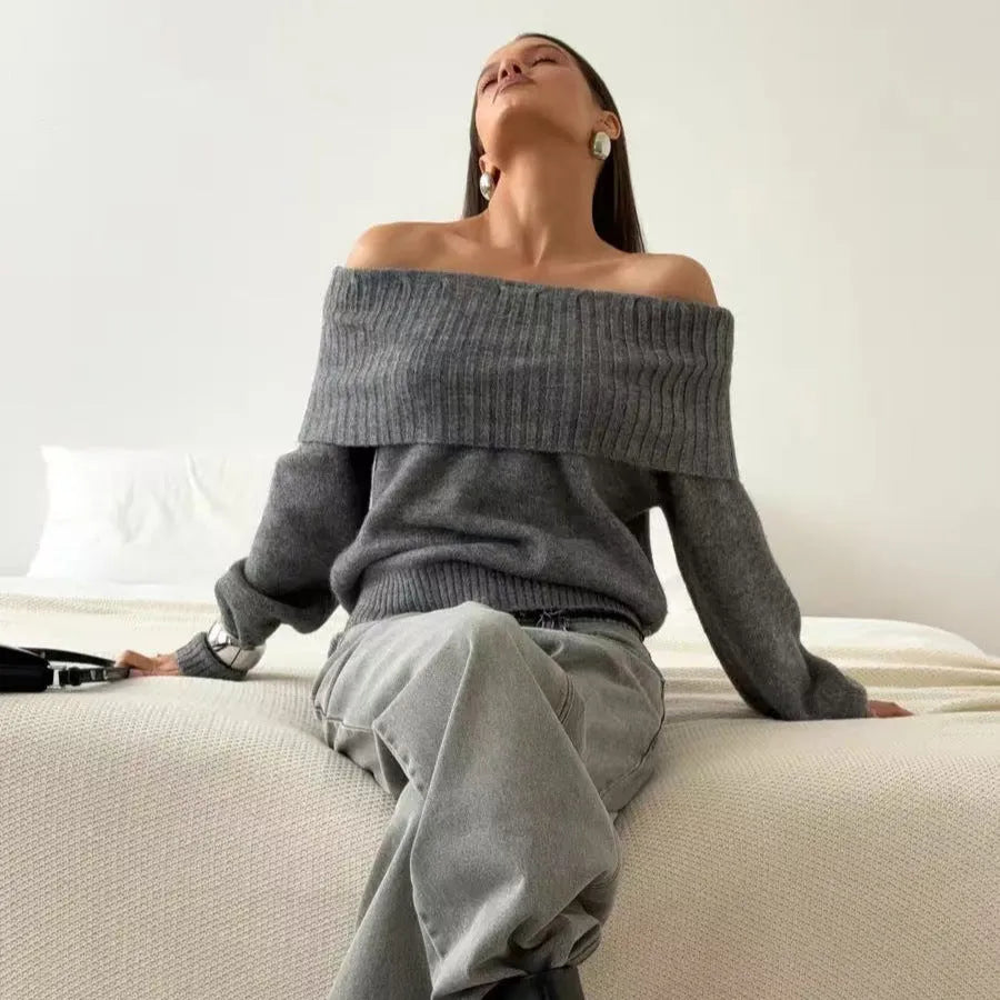 Grey off-the-shoulder sweater with a 3D textured pattern, shown on a model.