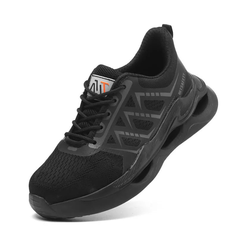 Black steel toe cap safety shoes with flat knitted uppers and rubber soles on a work surface