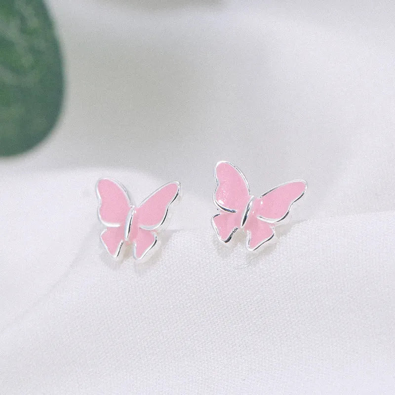 Side view of 925 silver butterfly stud earrings with geometric shape and plating finish