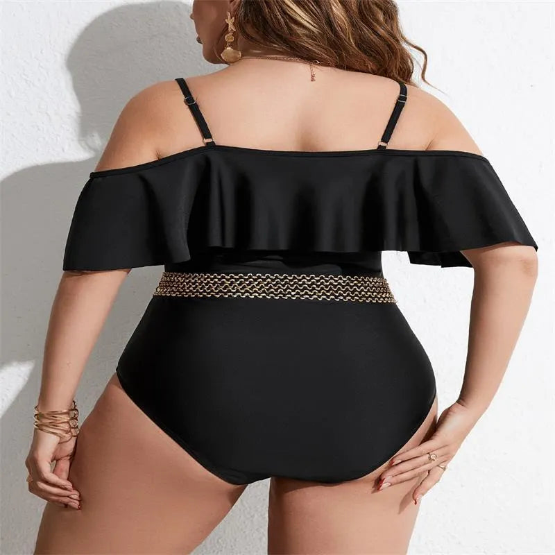 Black women's one-piece swimsuit on a hanger, plus size range 0XL to 4XL.