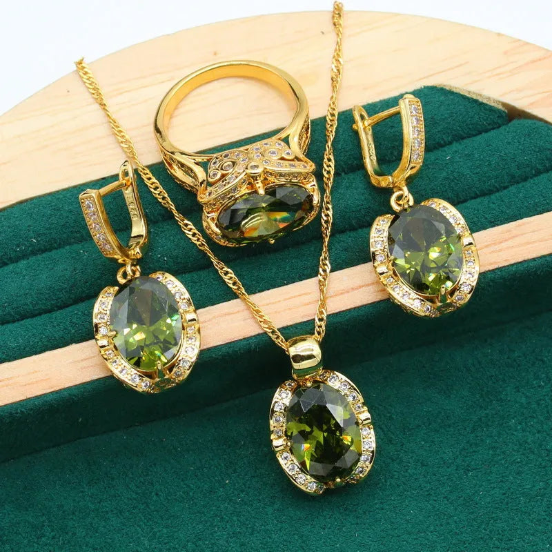 Complete zircon jewellery suit with necklace, earrings, and ring on snake bones chain in olive green colour