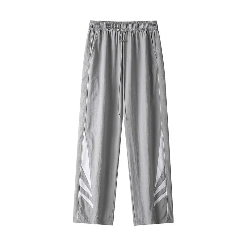 Men's straight leg loose-fit casual trousers in grey on a hanger.