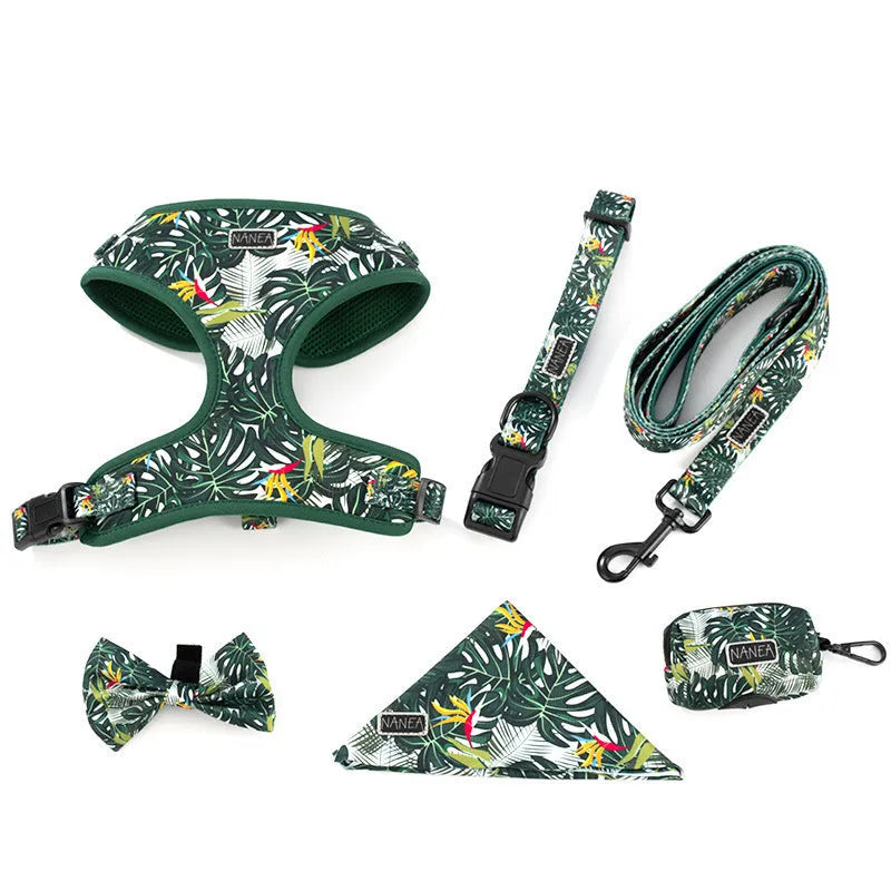 Adjustable cloth dog harness and lead six-piece set showing chest harness, collar, waste bag, bow tie, and scarf.