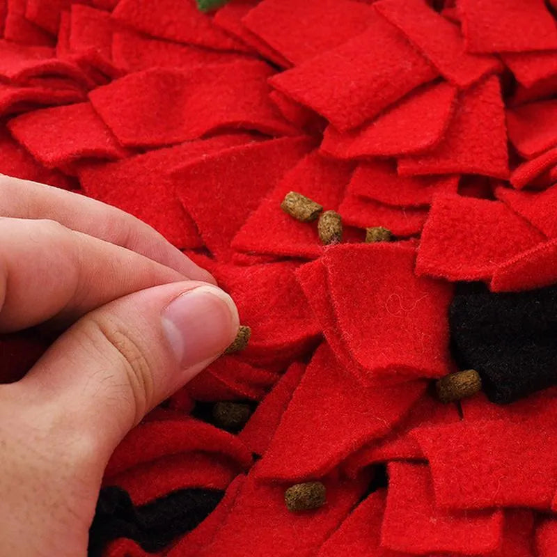 Red strawberry-shaped snuffle mat for dogs and cats as a slow feeder foraging toy.