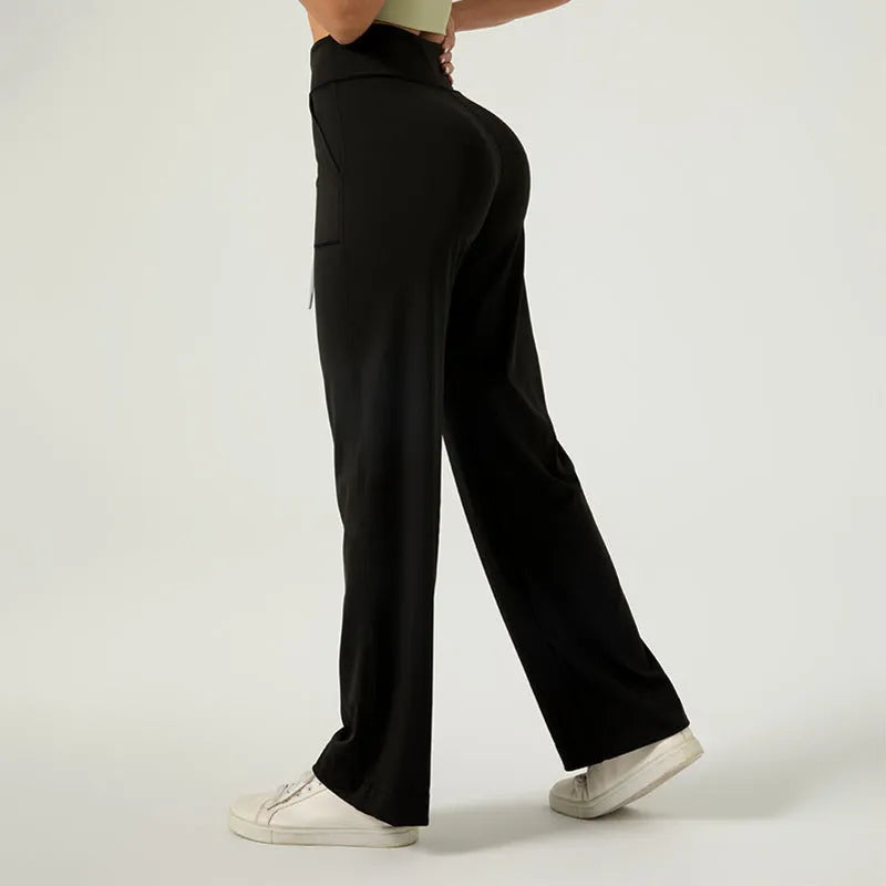 Women's high waist loose fit drawstring sports trousers in Star Black, side view, with elastic waistband and straight leg.