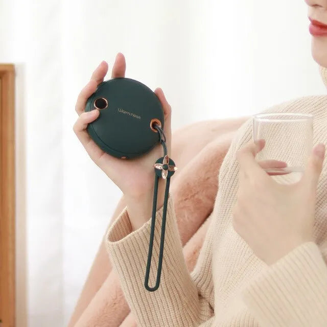 Green, pink or white portable power bank with digital display and integrated hand warmer function