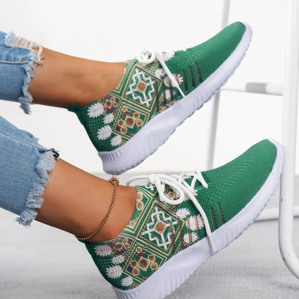 Women's woven flat casual sneakers in green with mesh upper, round toe, front lace-up, and rubber sole